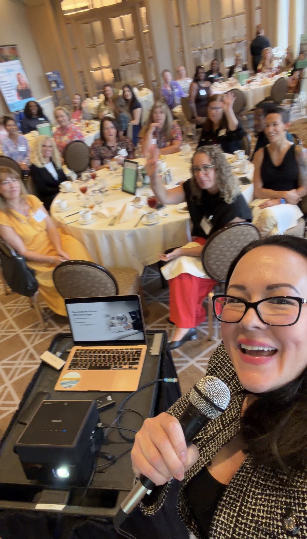 Tara with an engaged luncheon audience