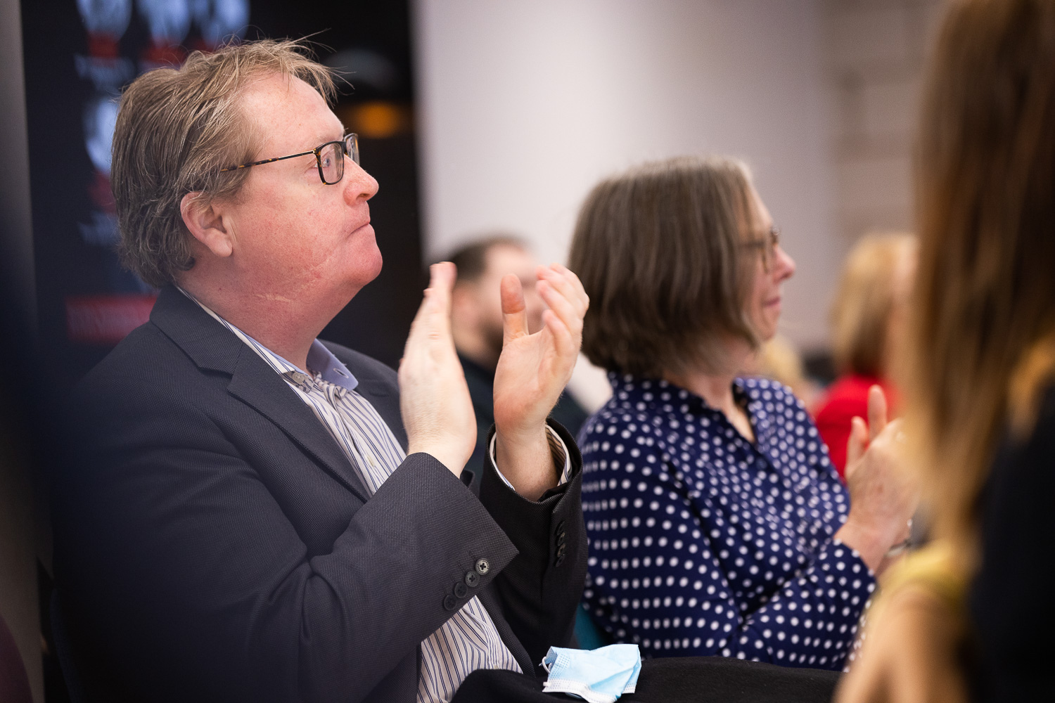 Audience members applauding