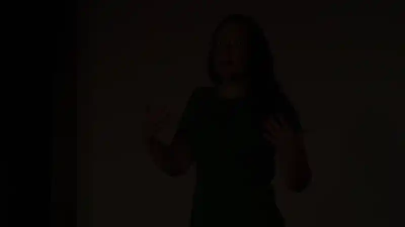 Tara speaking on the TEDx stage
